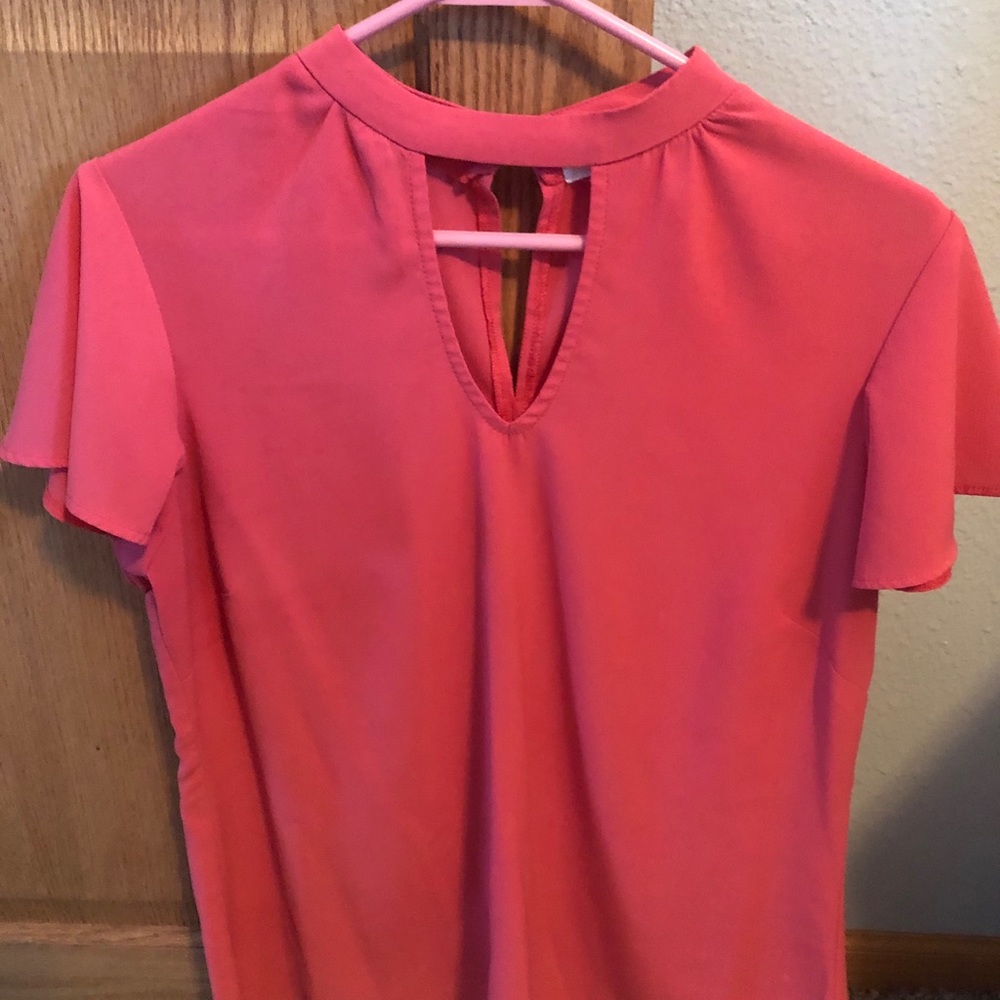Maurice’s open neck shirt.